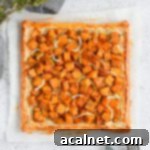 Pumpkin tart from above over a sheet of baking paper