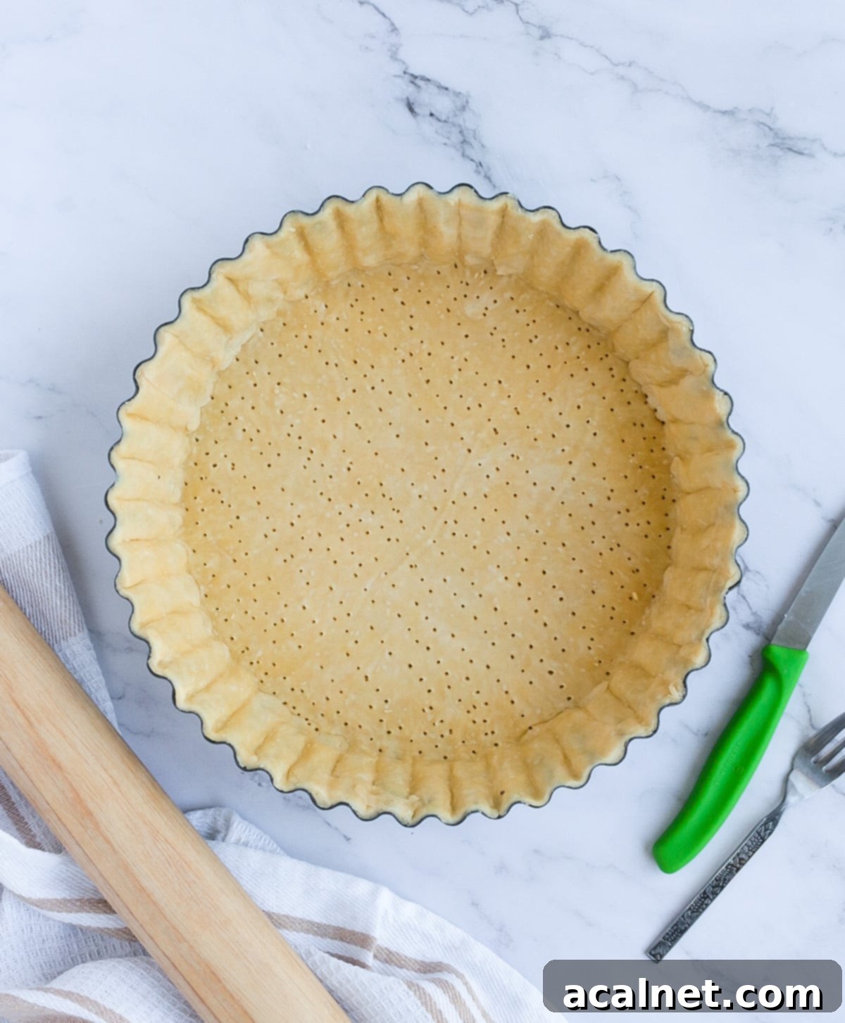 Unbaked Pastry lined in the baking pan from above
