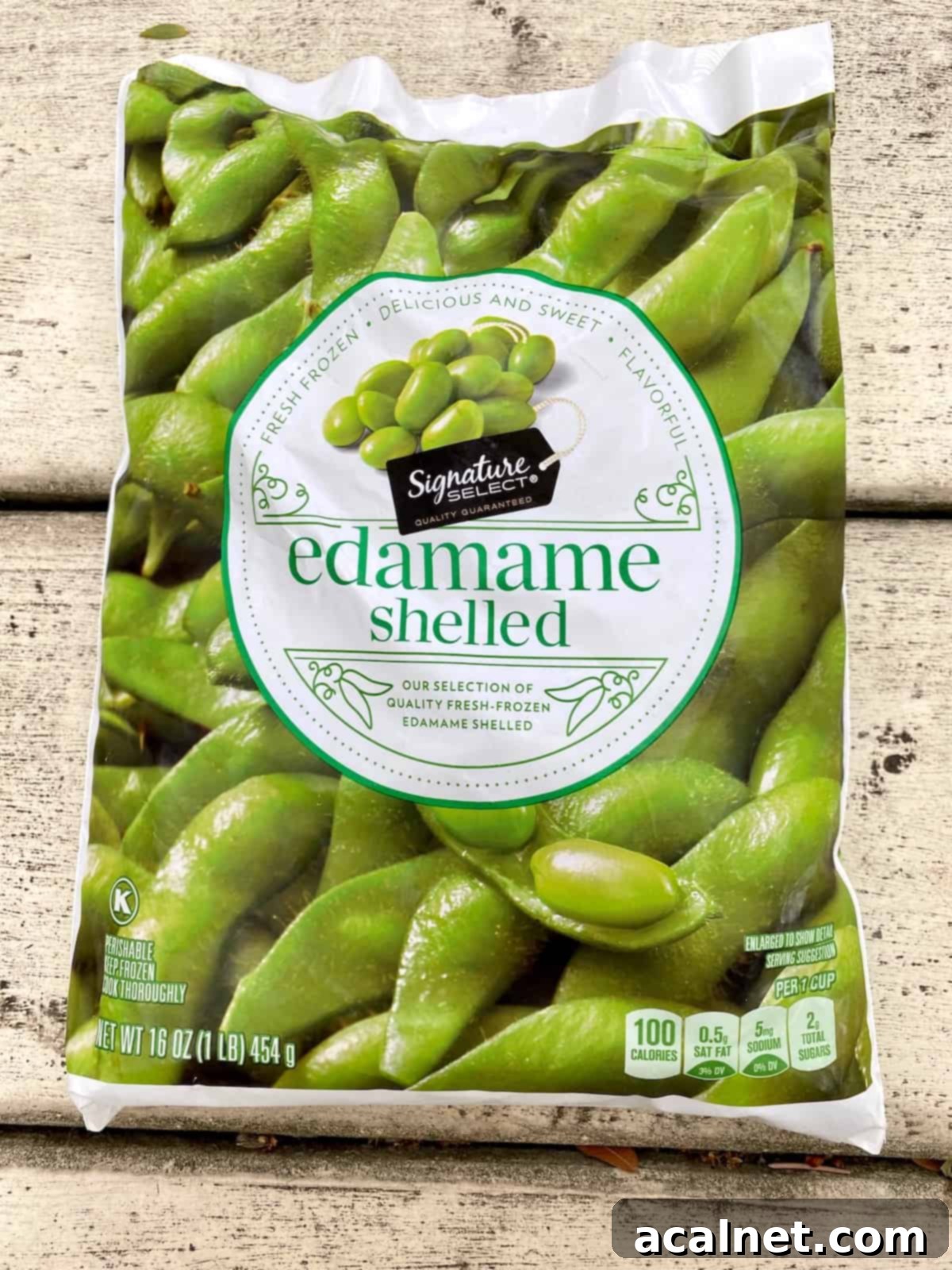 A clear plastic bag of frozen, shelled edamame is shown, highlighting its convenience for this recipe.