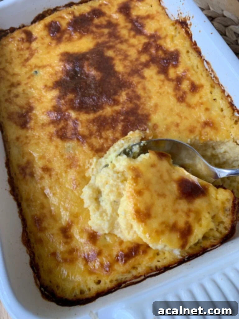 Baked cheesy chili grits in a dish.