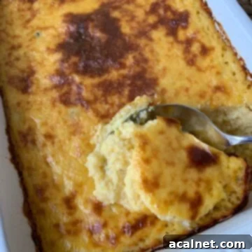 Baked cheesy chili grits in a dish.