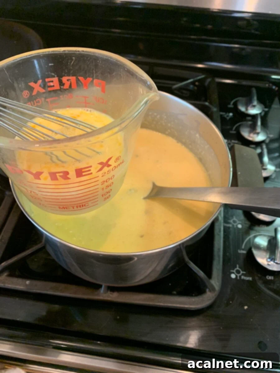 Grits cooking on the stove. 