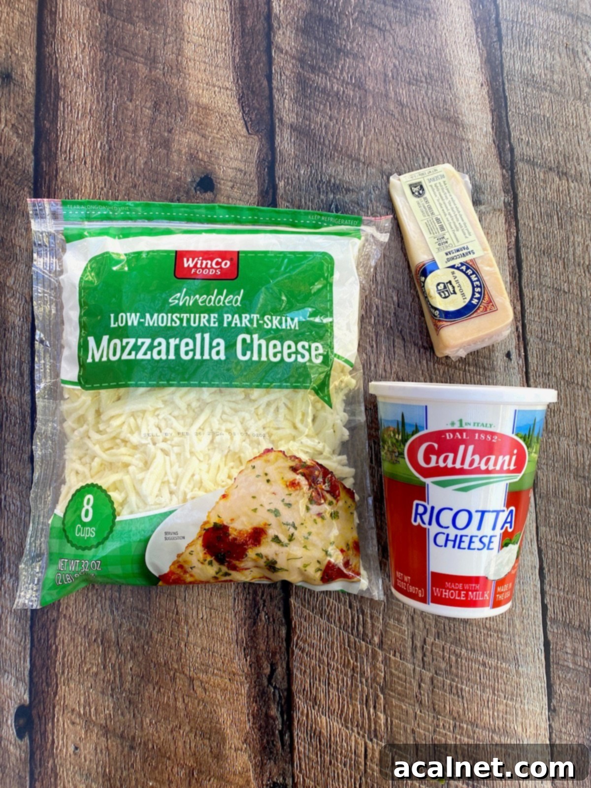 Sweet Potato Lasagna Perfection 5 Packages of fresh mozzarella, creamy ricotta, and grated Parmesan cheese displayed on a wooden surface.