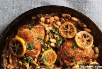 Crispy Lemon Chicken Thighs with Artichokes and White Beans