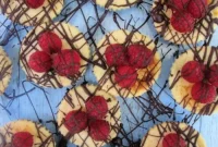 Mini Raspberry Cheesecakes with Chocolate Drizzle