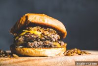 Crispy Flat-Top Cheeseburger Recipe with Caramelized Onions