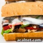 A close up view of a vegetarian mushroom philly cheesesteak sandwich.