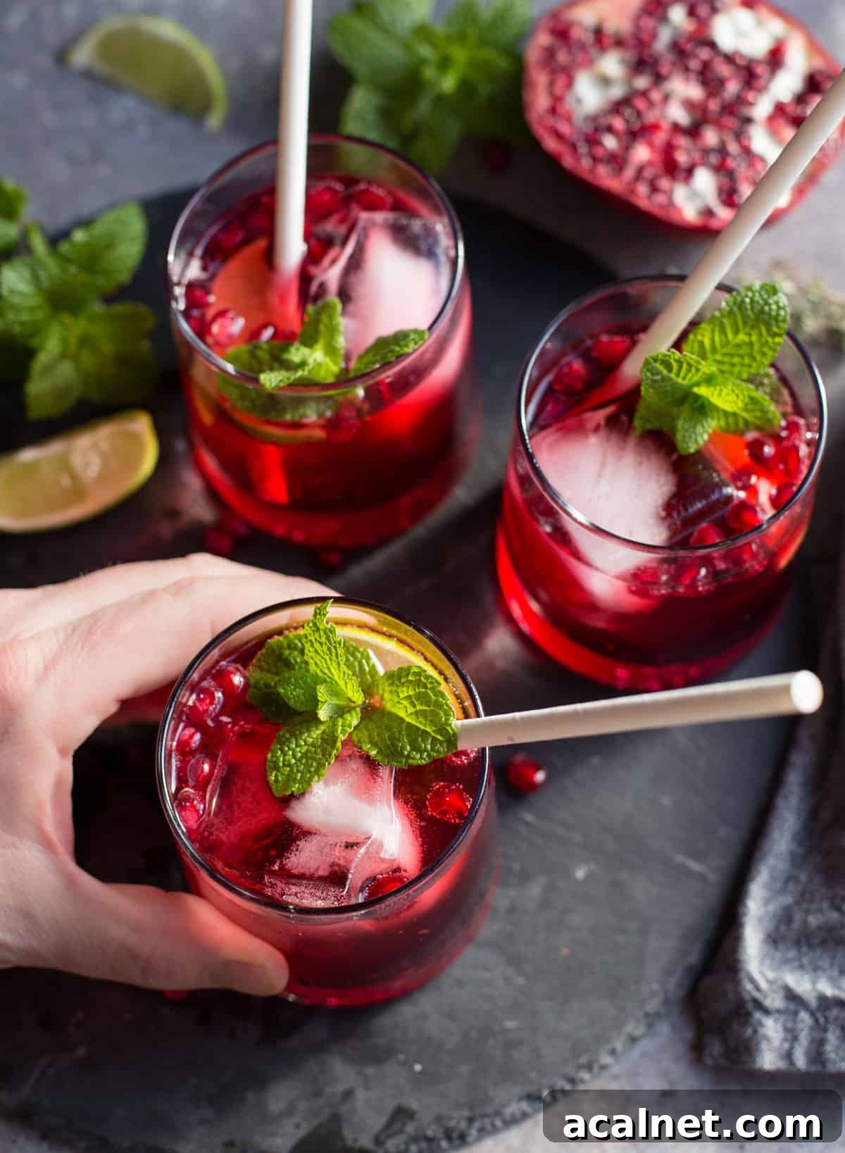 Pomegranate Ginger Beer Cocktail Recipe: Sparkling Holiday Drink 5 Three glasses filled with ginger pomegranate cocktails