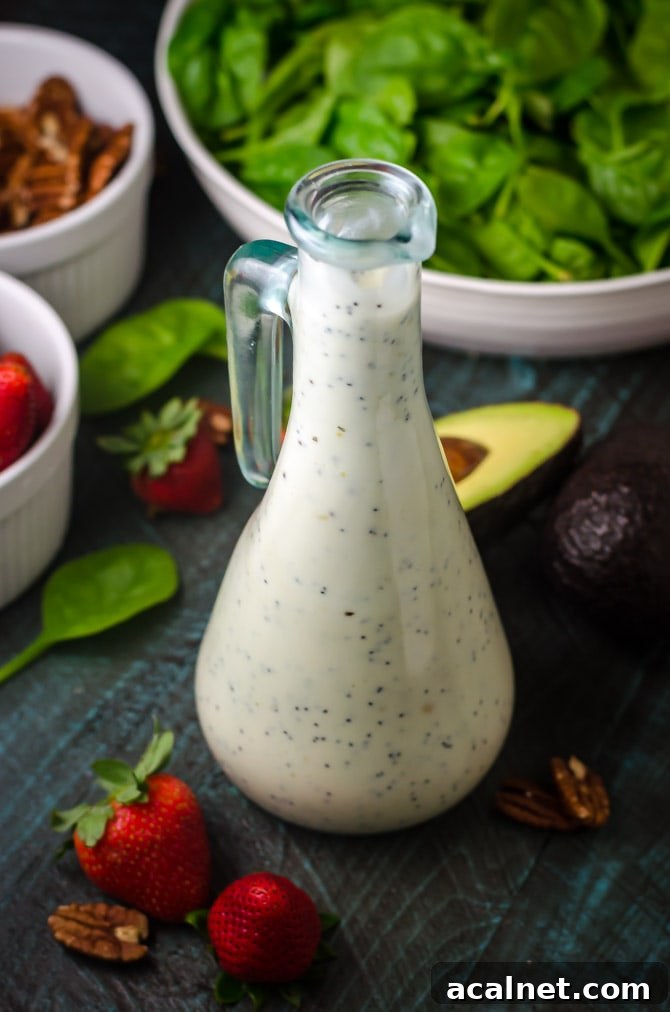 Strawberry Avocado Spinach Salad with Greek Yogurt Poppy Seed Dressing. This simple salad is full of creamy, crunchy, nutty, fruity, tangy, and summer-friendly flavors. You're gonna love it! | hostthetoast.com