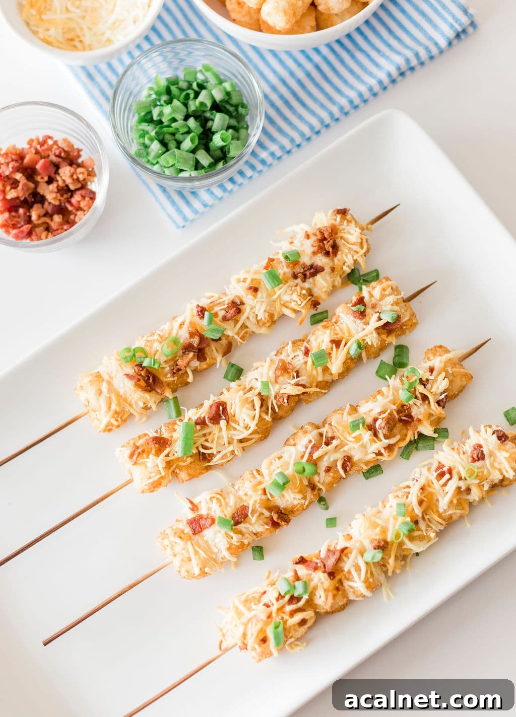 Close-up of loaded tater tot skewers