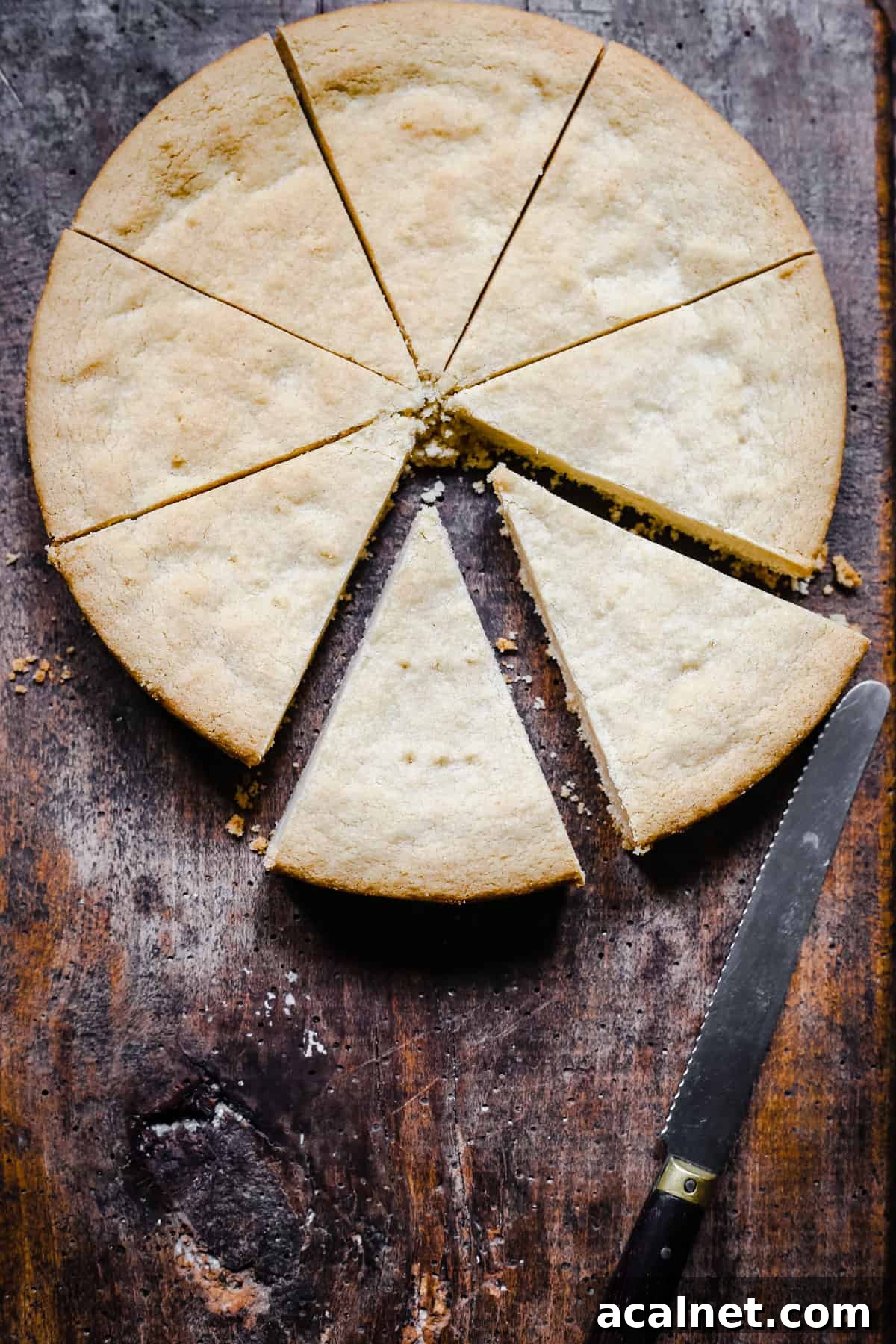 Gluten-free shortbread on a wooden board cut into pieces