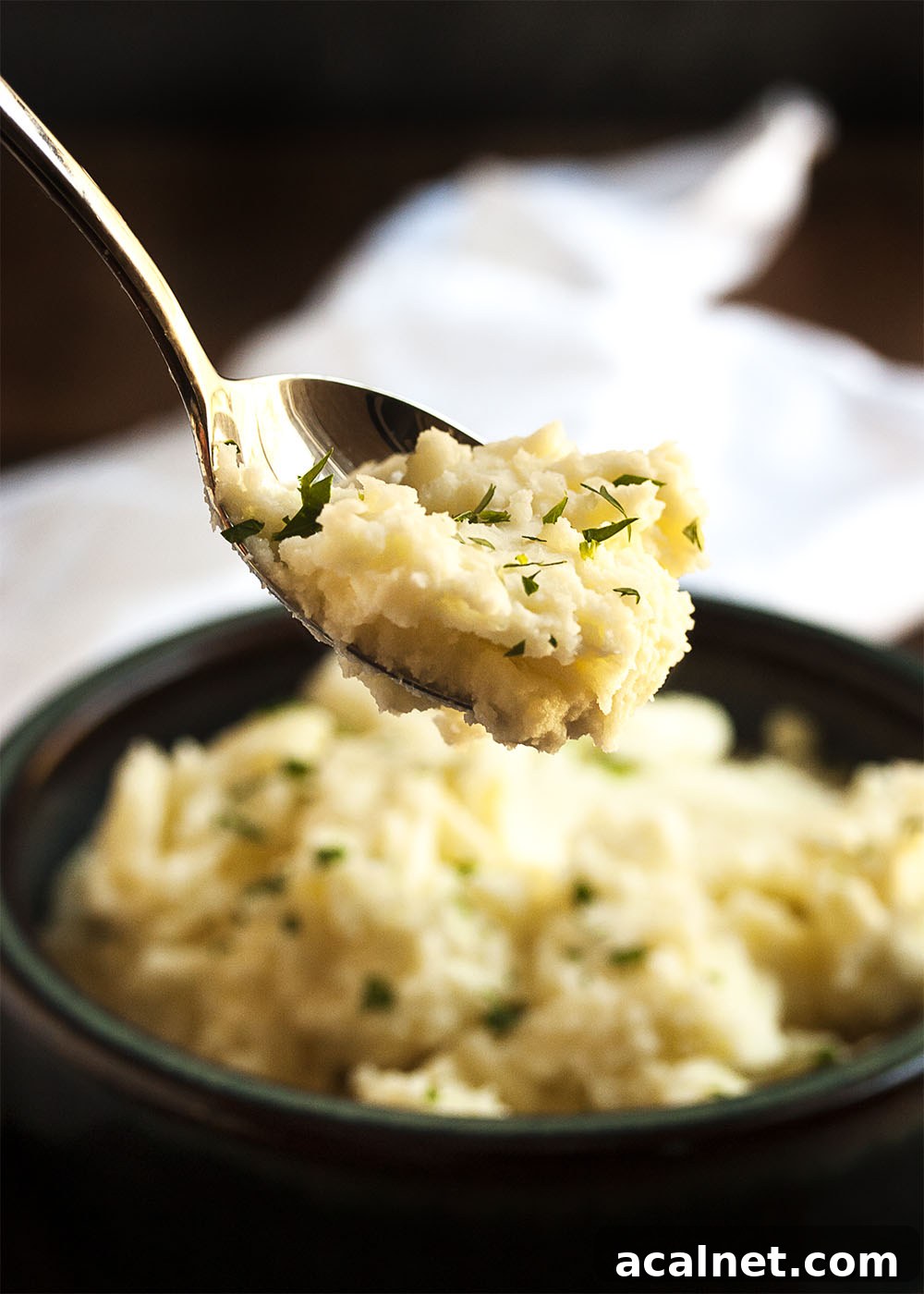 Cream Cheese Mashed Potatoes - Peeled yellow potatoes are simmered in salted water and then mashed with cream cheese and a splash of heavy cream in these amazingly tasty mashed potatoes.