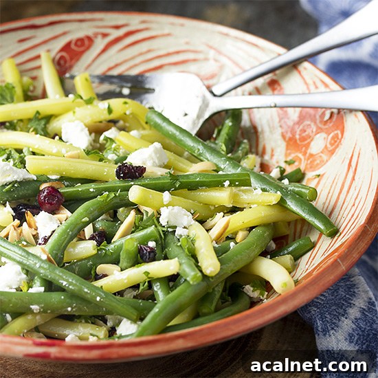 This fresh green bean almond salad with goat cheese and dried cranberries is tossed with a simple vinaigrette. It's the perfect salad for any night. Great for summer parties, weeknight dinners, holidays like Thanksgiving and Christmas.