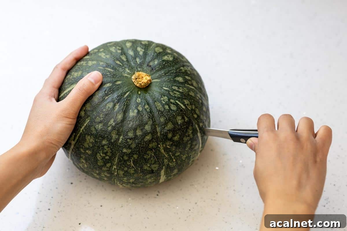 Piercing a kabocha pumpkin with a knife.