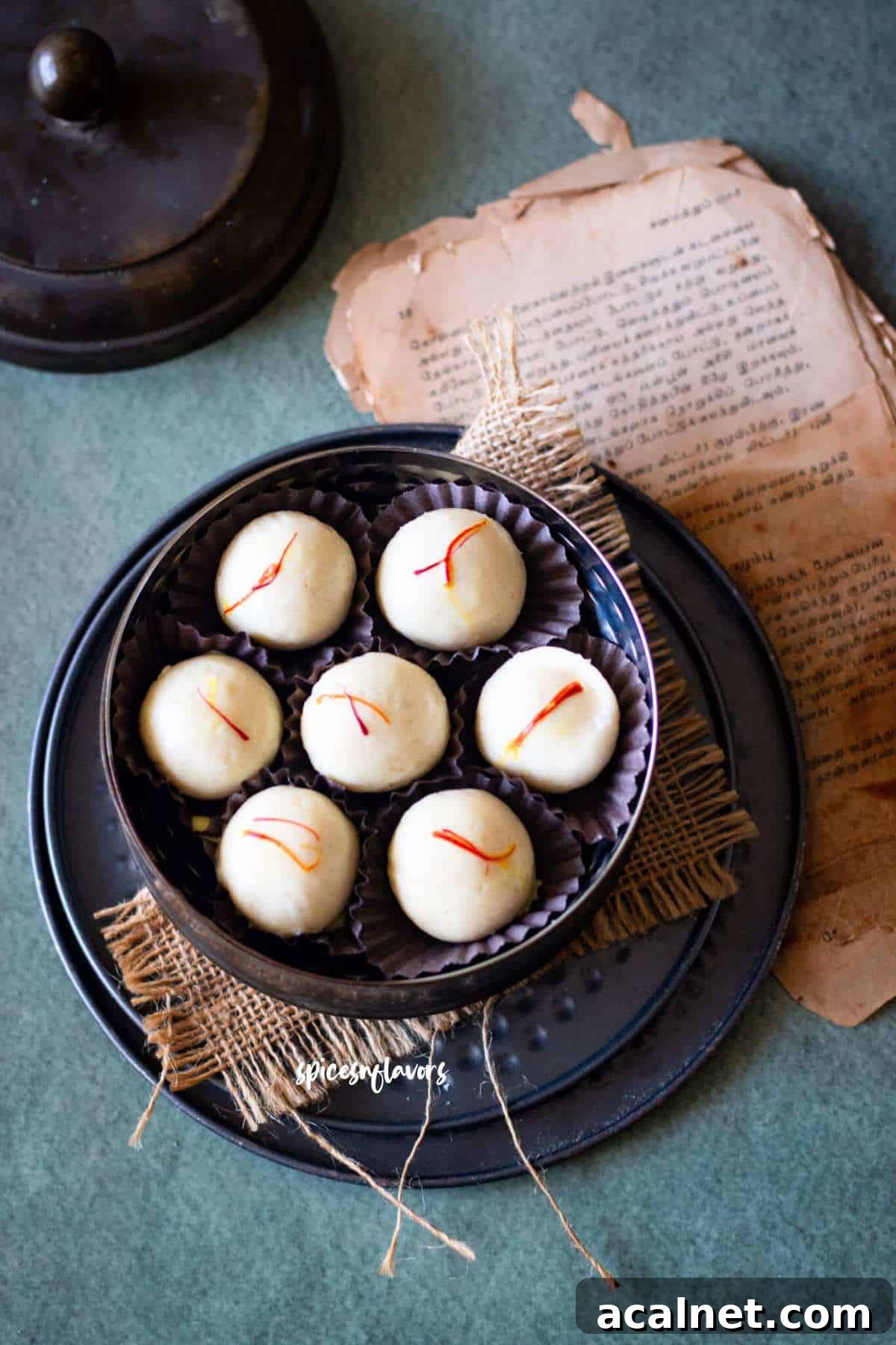 no cook malai ladoo placed in a dabba