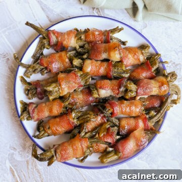plate of bacon wrapped green bean bundles.
