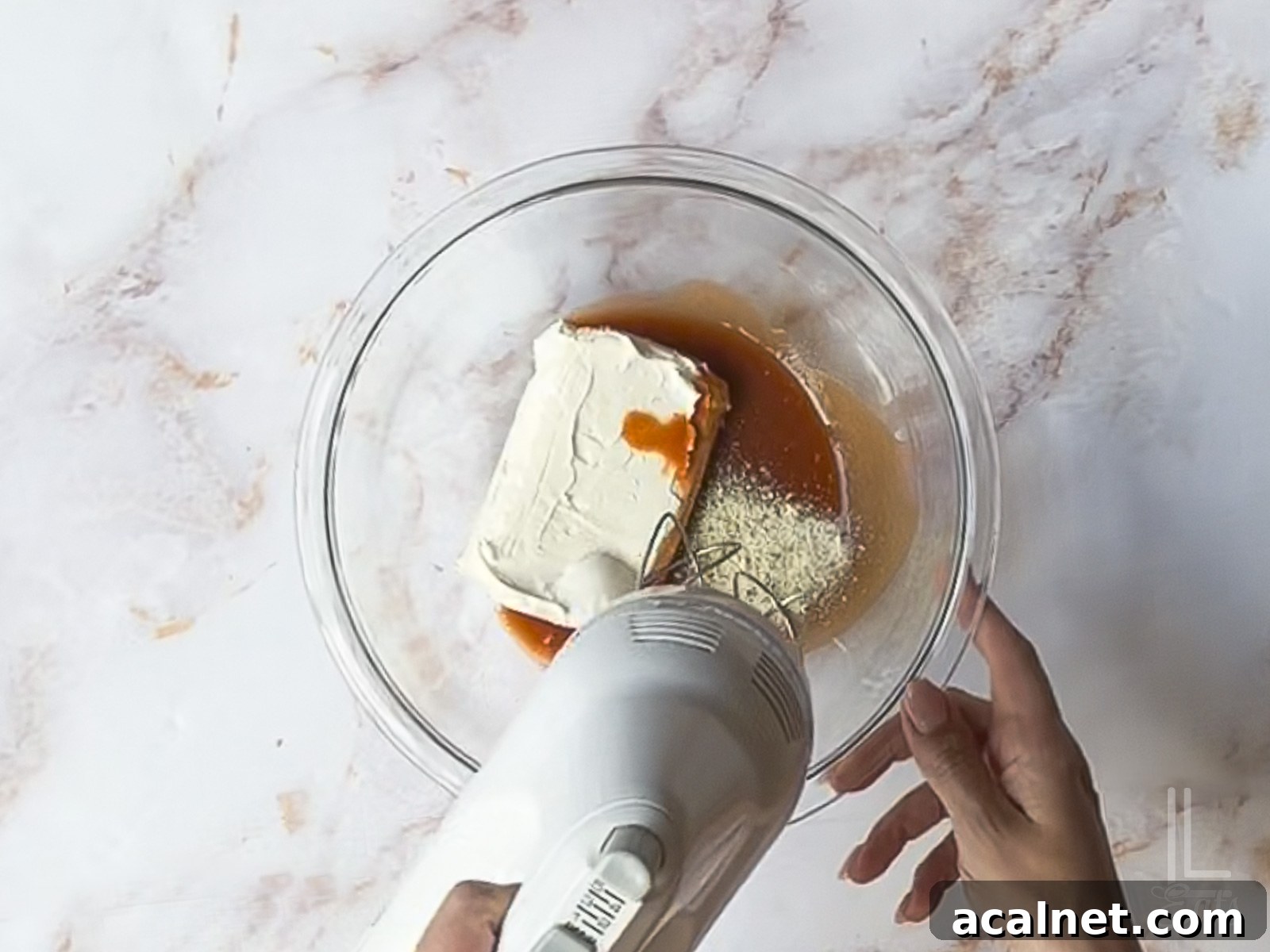 Buffalo Chicken Pinwheels Recipe — Spicy Appetizer Roll-Ups 6 using a hand mixer to blend hot sauce, cream cheese, and ranch.