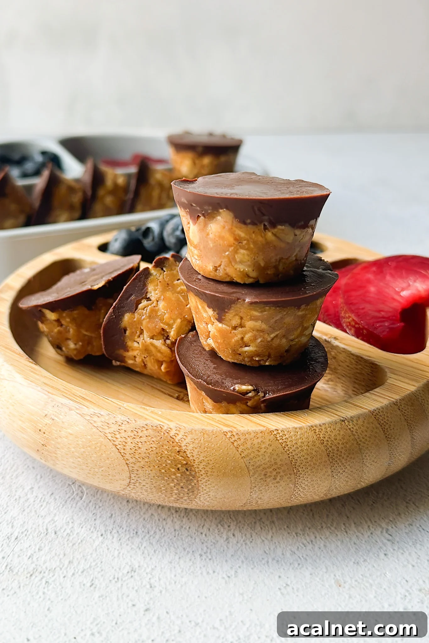 Peanut butter oatmeal cups served with berries.