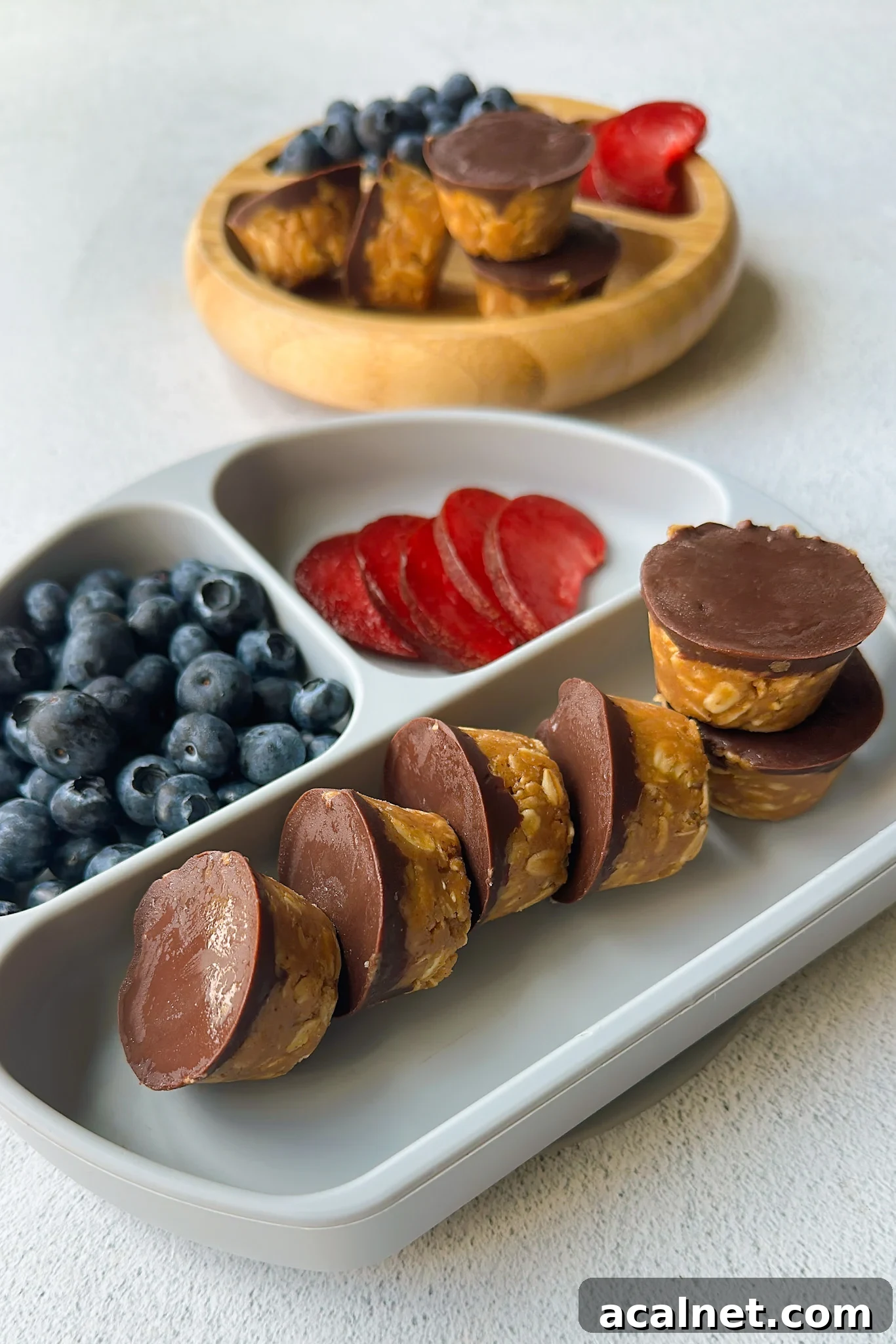 Peanut butter oatmeal cups served with berries.