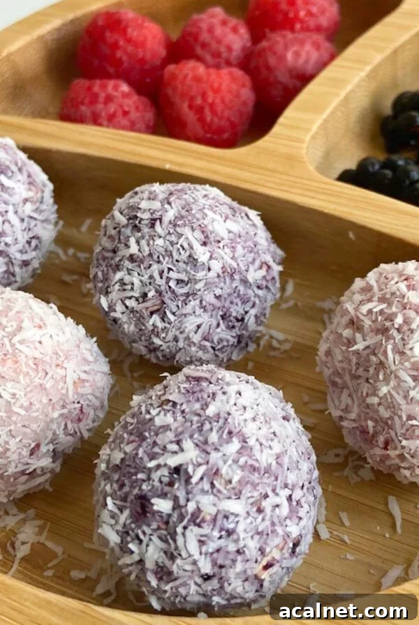 Berry bliss balls served with raspberries and blackberries