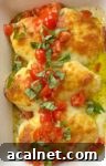 How to make chicken breasts topped with a mixture of cream cheese and basil pesto followed by lots of shredded mozzarella.