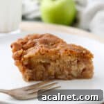 Swedish Apple Pie on a plate with a fork.