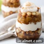 Close up of apple trifle topped with whipped cream.