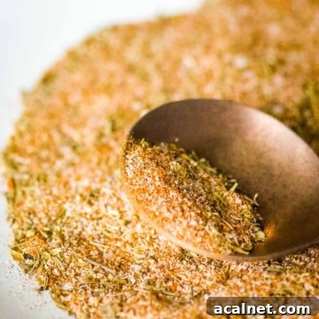 Closeup shot of homemade blackening seasoning on a copper spoon.