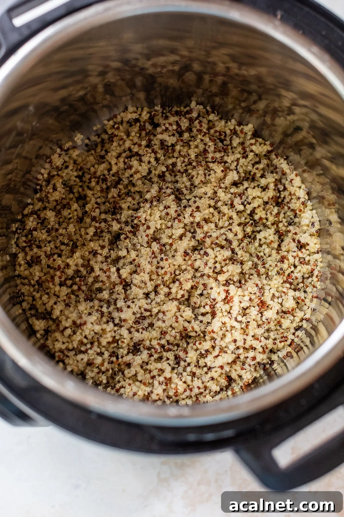 overhead view of cooked quinoa in an Instant Pot.