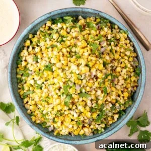 turquoise bowl filled with grilled corn salad