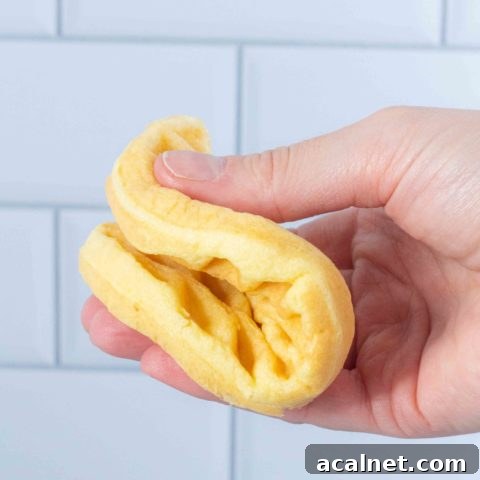 a wonder bread chaffle is bent in half. It is soft and not tearing.