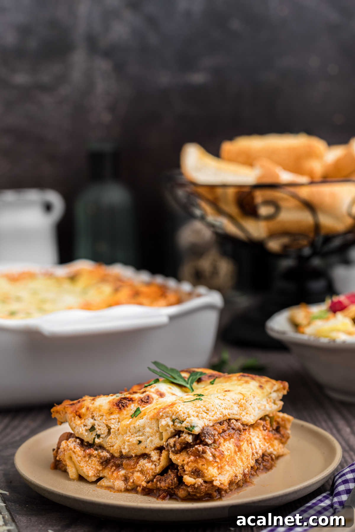 A plate with a slice of venison lasagna.