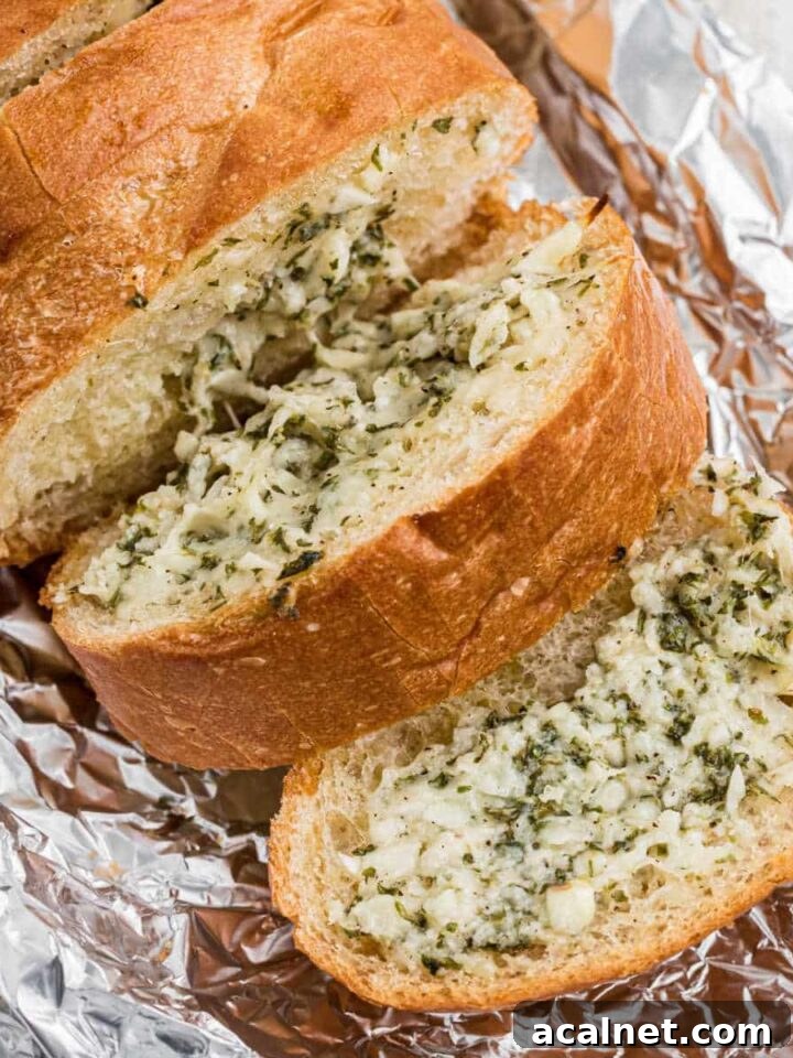 Stuffed garlic bread slightly opened to show inside.