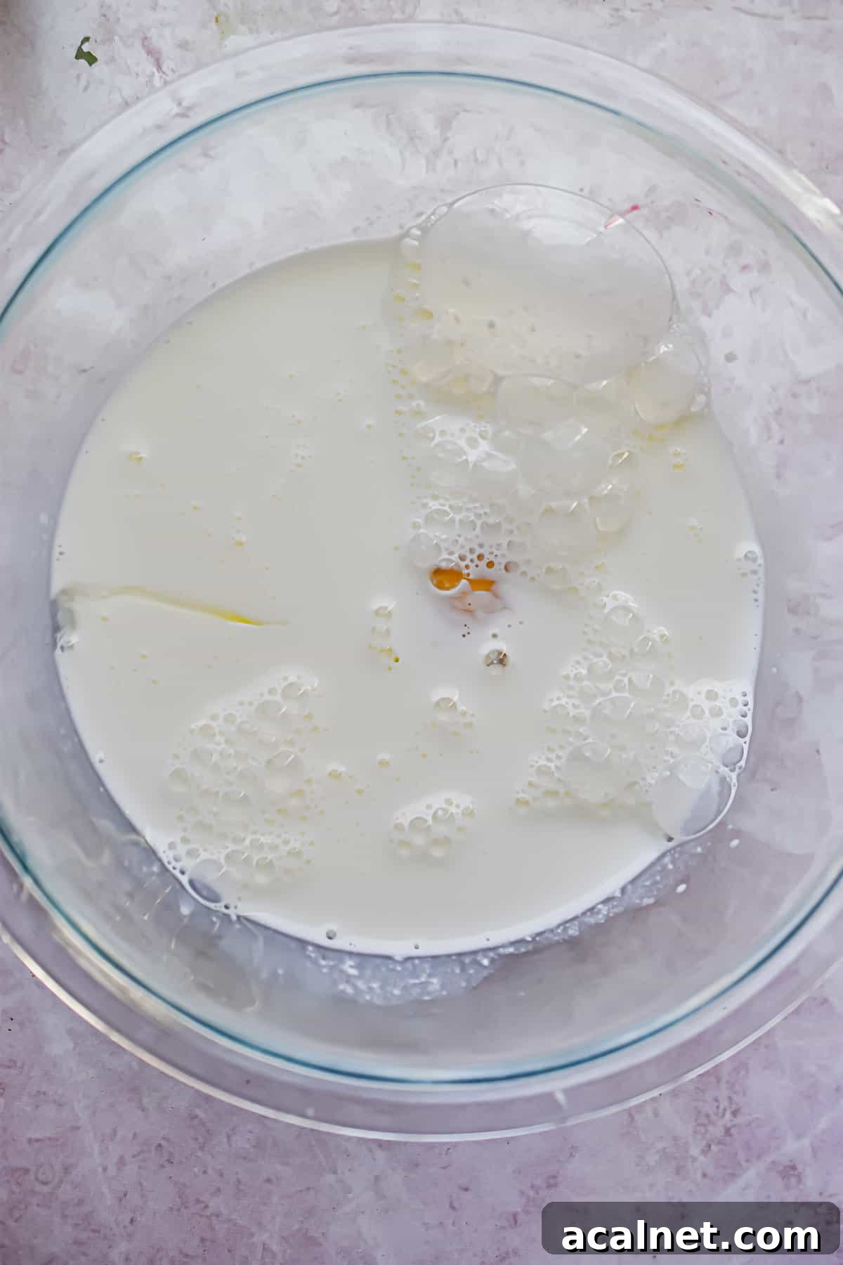 Fluffy Pancakes Made with Cake Flour: Light, Tender Stacks 4 The wet ingredients are mixed together in a bowl.