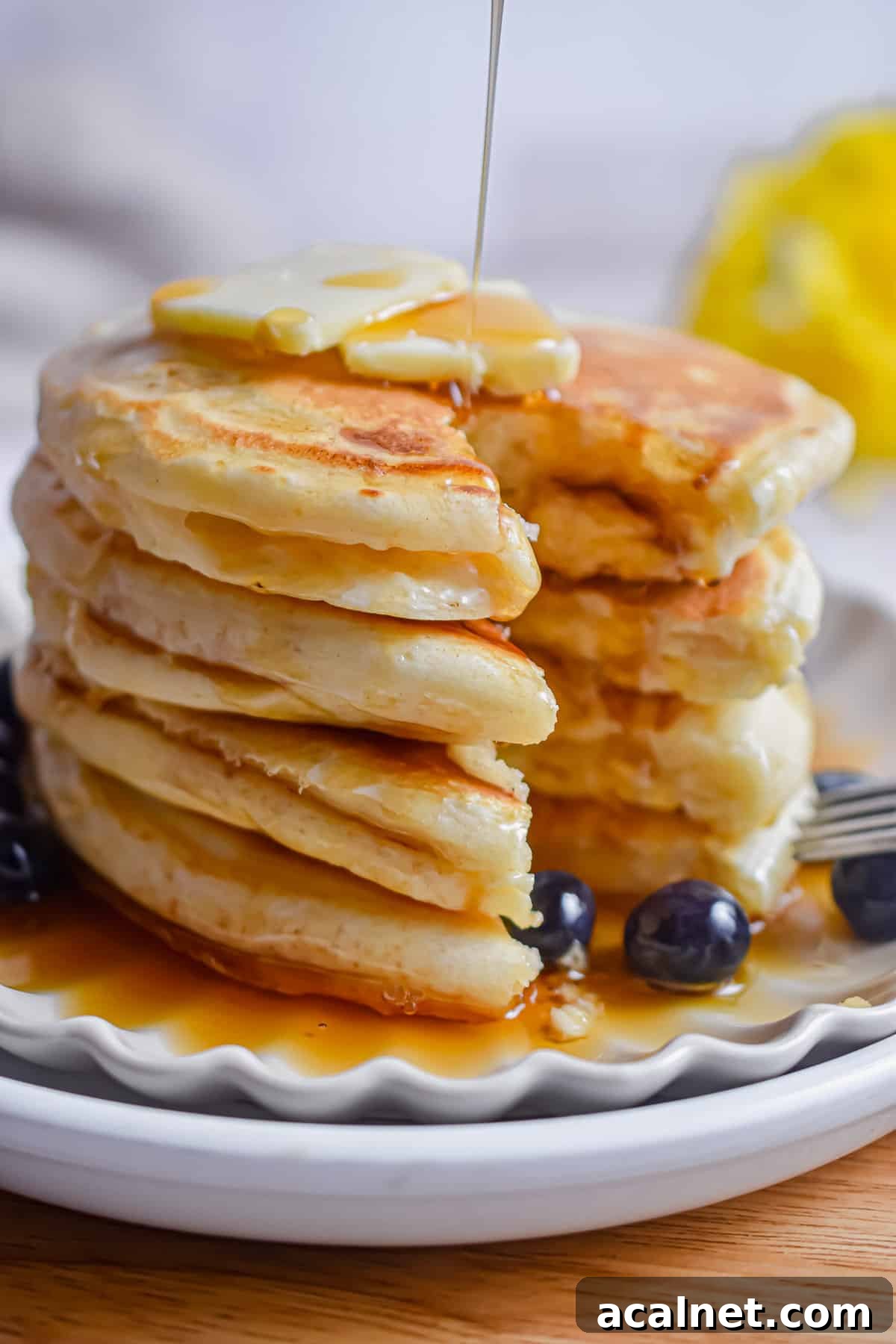 Fluffy Pancakes Made with Cake Flour: Light, Tender Stacks 9 A portion of the pancakes with cake flour is cut out of the stack.