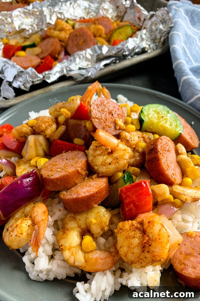 Shrimp, red onions, corn, zucchini, and sausage over a bed of rice.