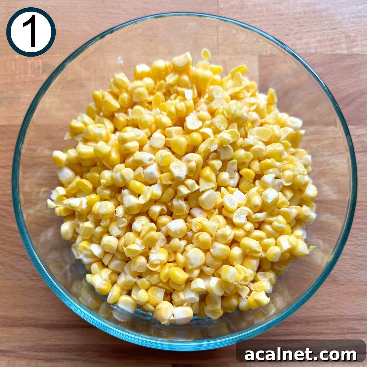 Mexican Street Corn Cups Recipe – Creamy Elote in a Cup 4 Glass bowl with fresh corn kernels in it.