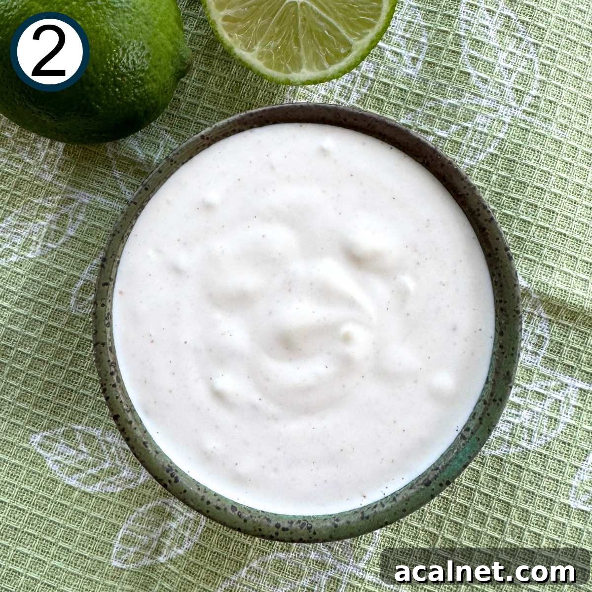 Mexican Street Corn Cups Recipe – Creamy Elote in a Cup 5 Mixture of mayonnaise, sour cream, lime juice, pressed garlic, and cayenne pepper in a small bowl.