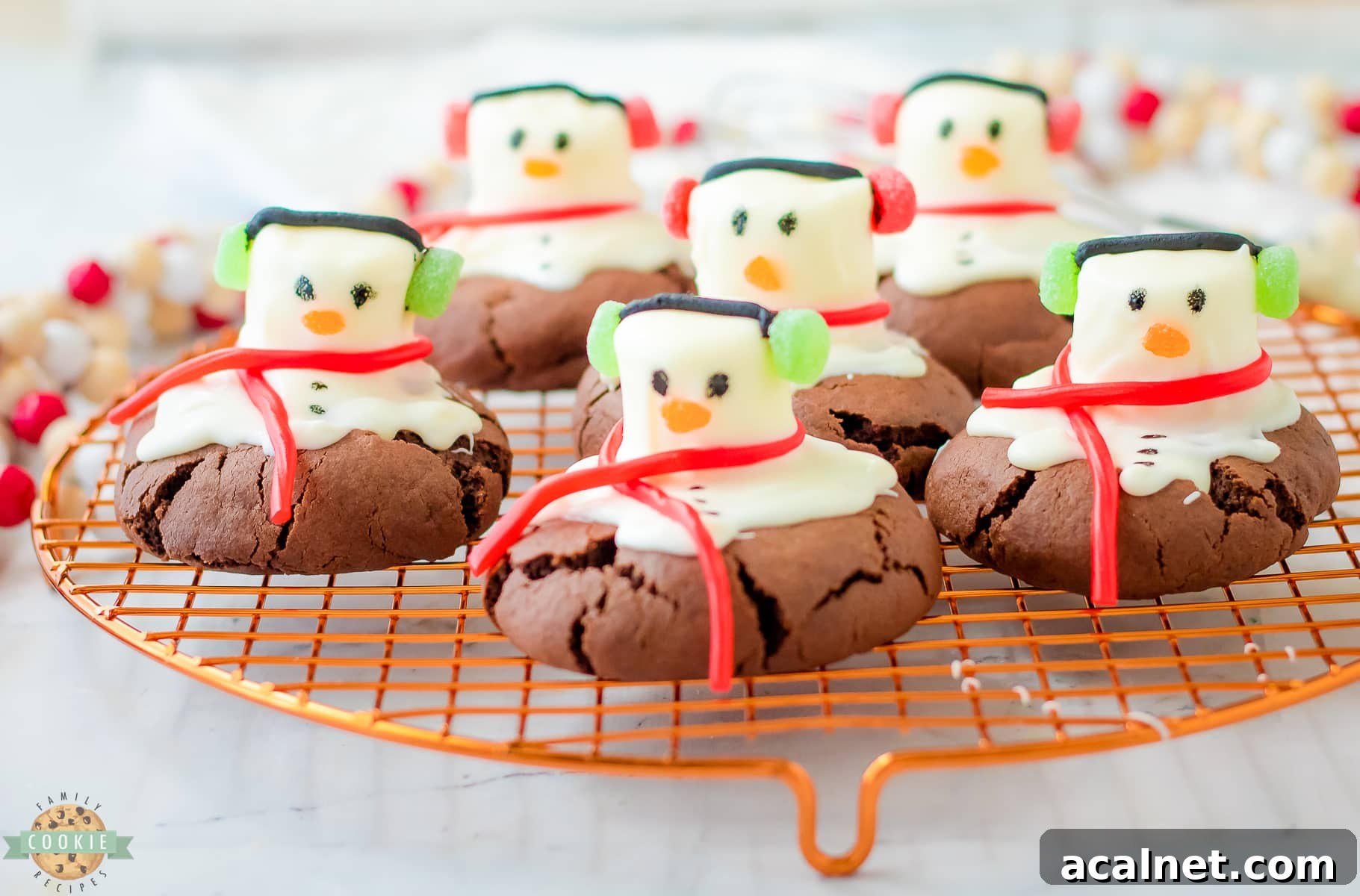 peppermint snowman cookies on a cooling rack