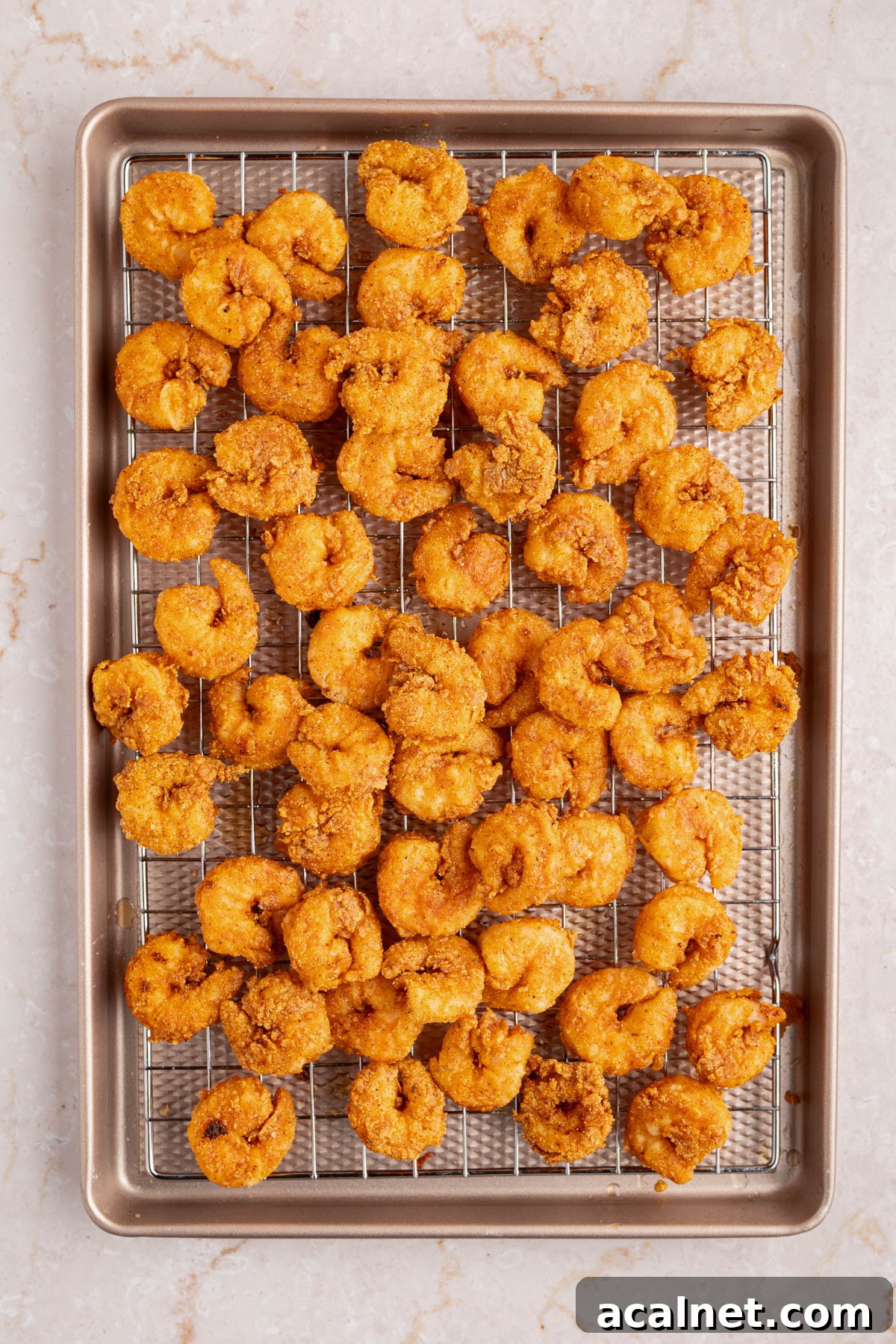 Crispy Shrimp Po' Boy Sandwich Recipe for Classic New Orleans Flavor 9 The shrimp frying in the preheated oil.
