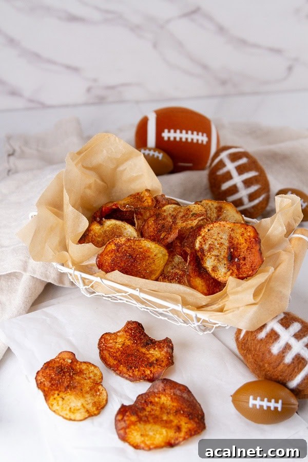 BBQ potato chips in a wire basket with some football decorations around.