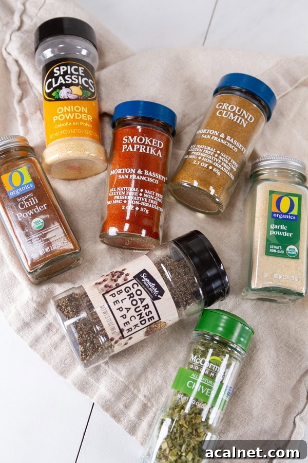 spice jars laid out on a cloth napkin.