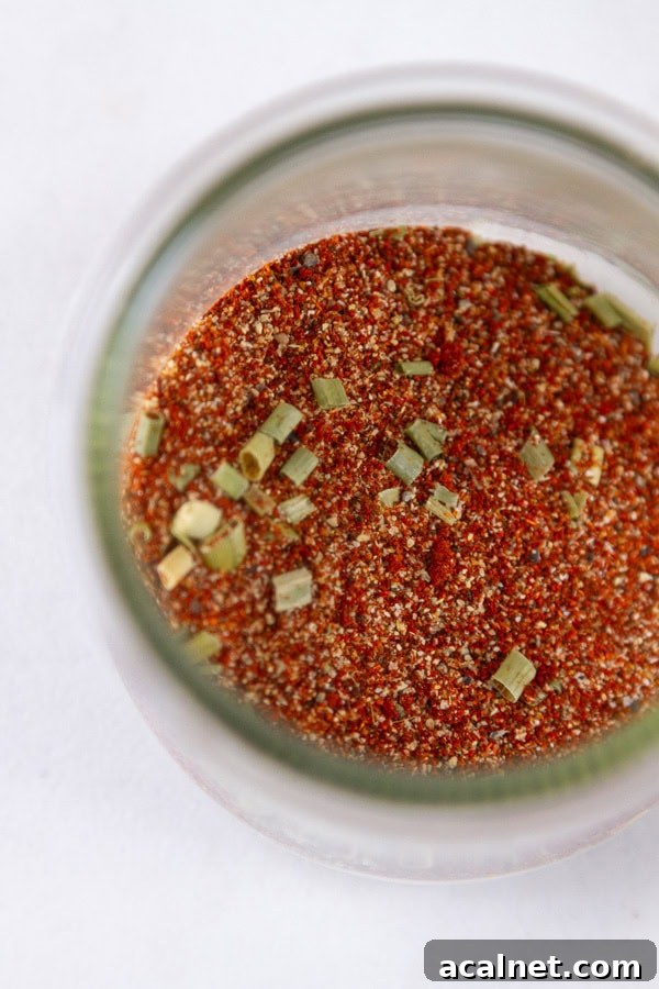 Looking down into a glass jar filled with spice.