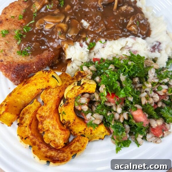 roasted delicata on plate with tabbouleh and schnitzel