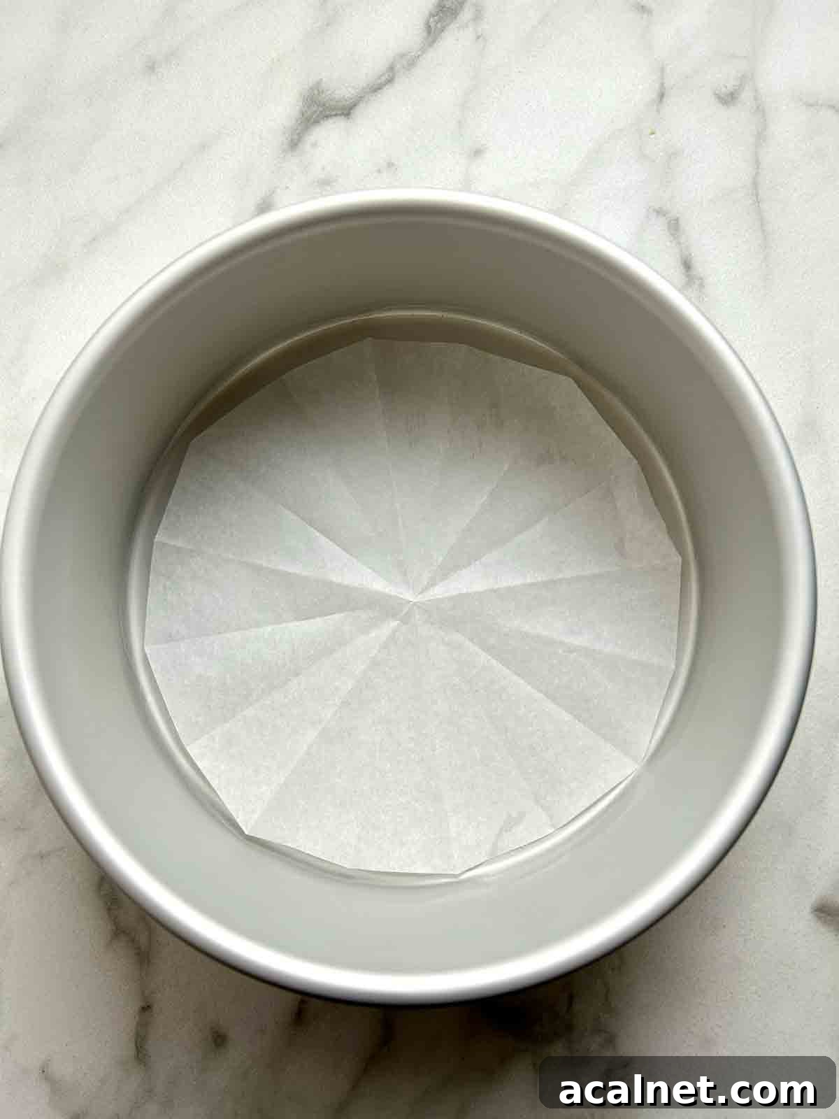 cake pan lined with parchment paper.