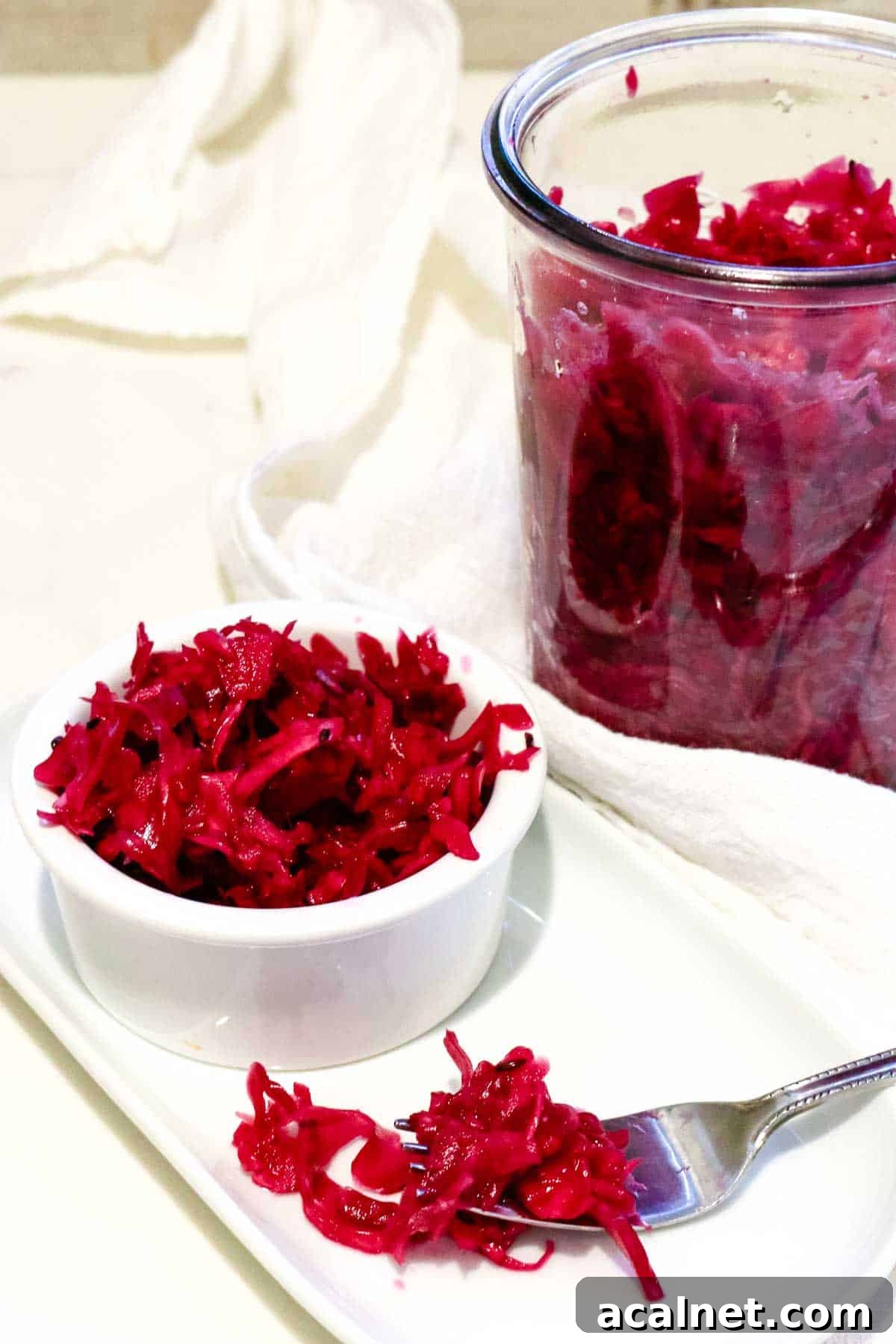 Fermented Red Cabbage sauerkraut recipe in a small ramekin and jar.