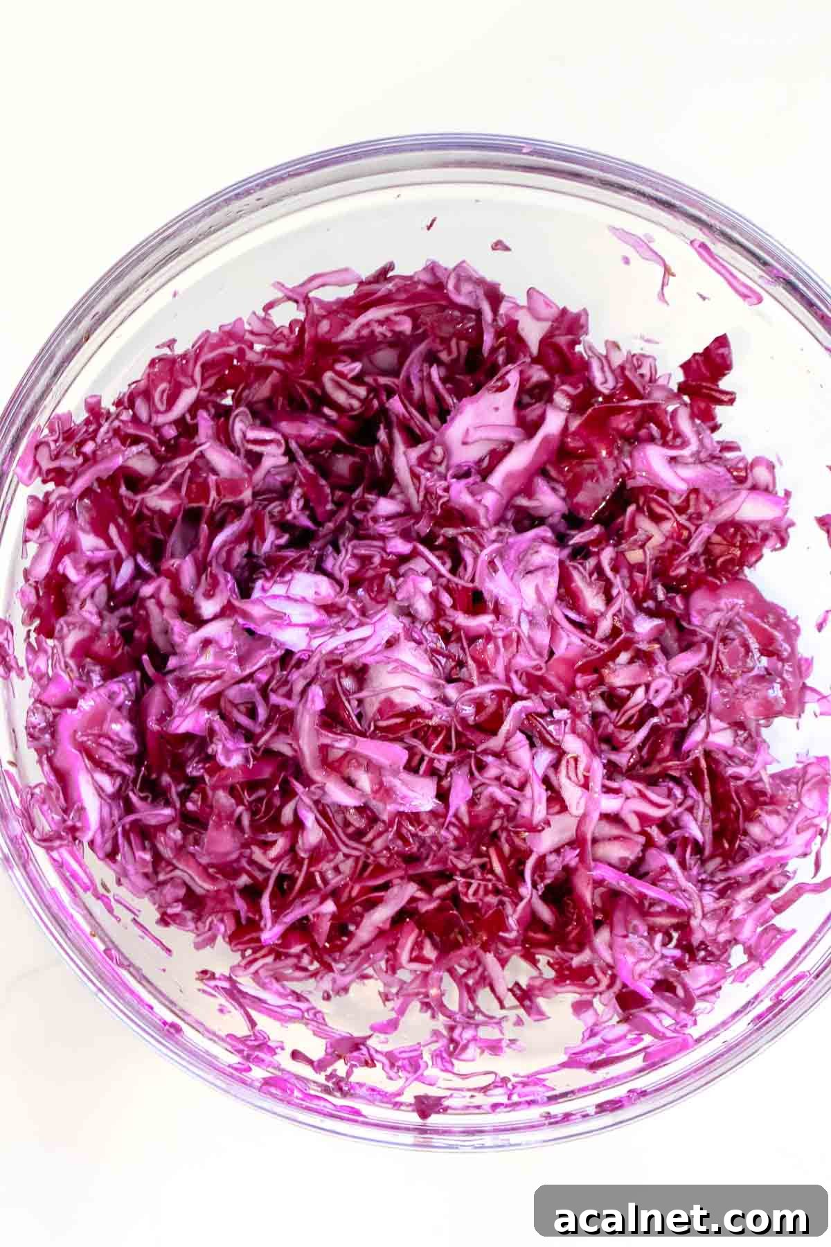 massaged red cabbage in glass bowl
