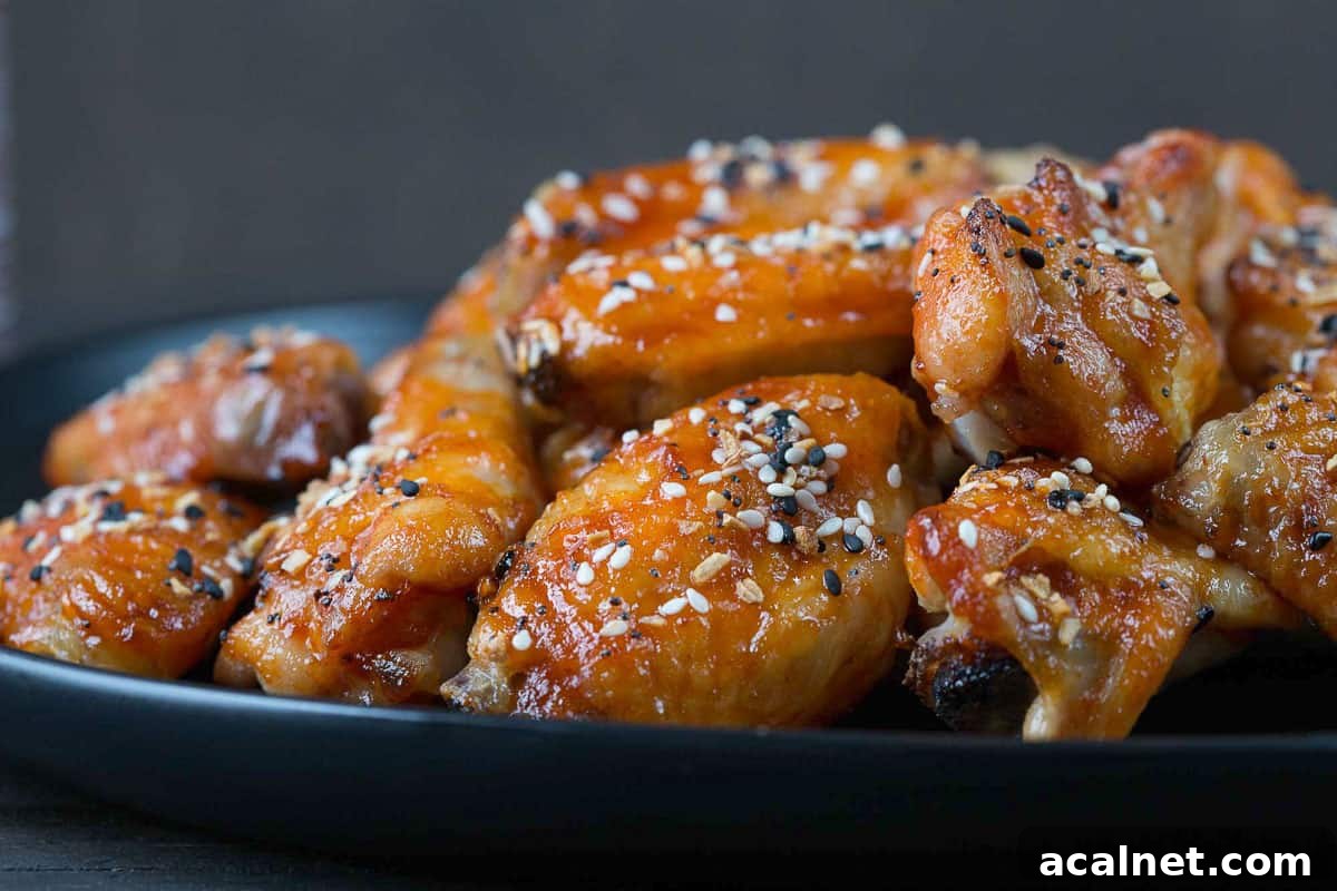 plate of sweet and spicy wings topped with everything bagel seasoning.