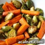 Roasted Brussels Sprouts and carrots with honey butter in serving dish.