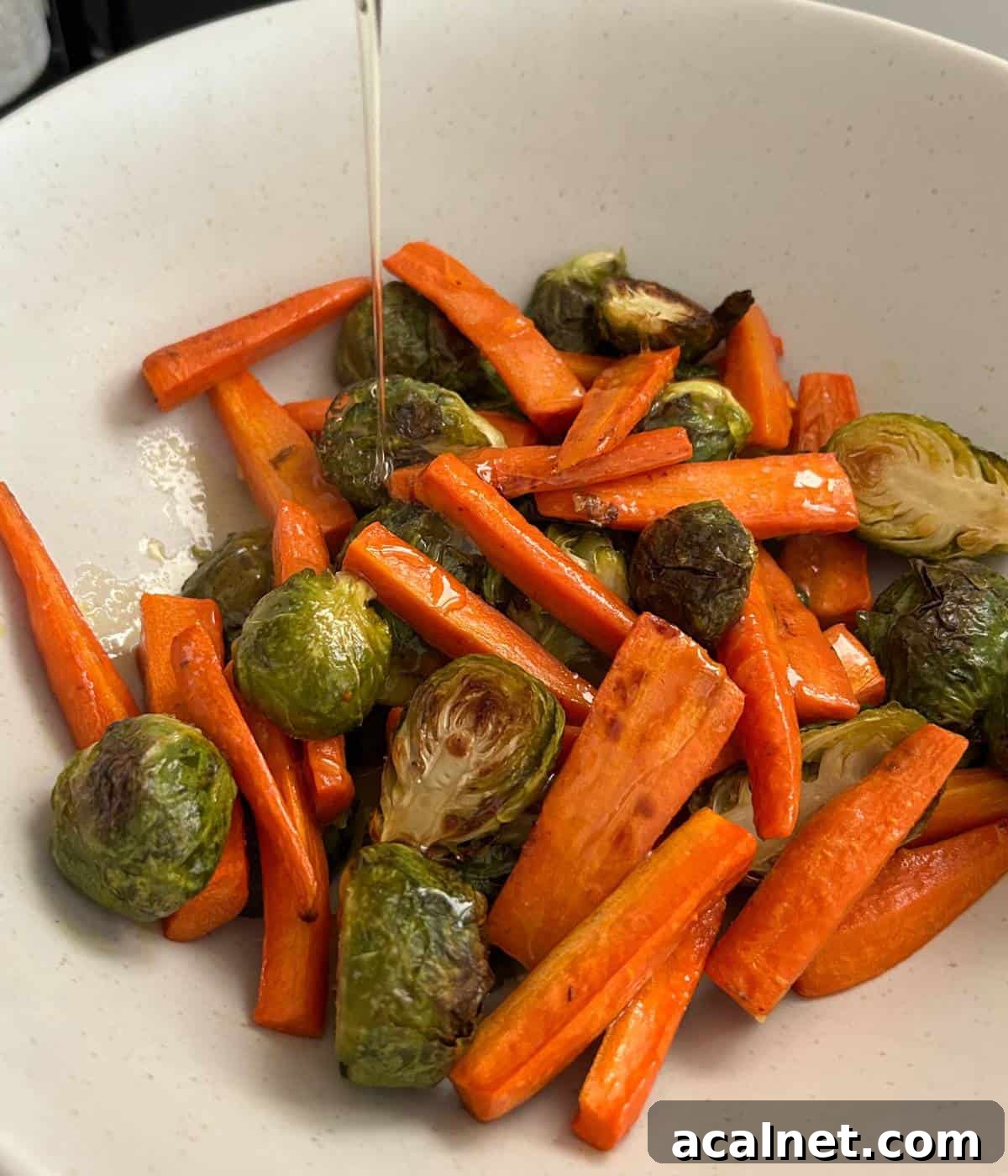 Honey butter topping over roasted veggies.